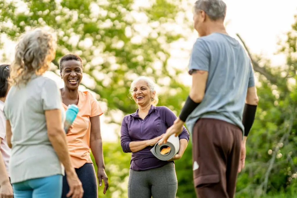 A group of active senior residents from Kendal on Hudson that finished a yoga class.