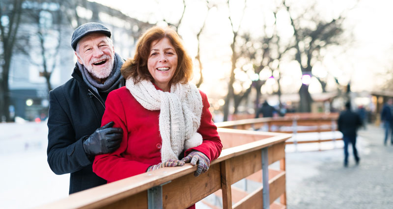 Smiling couple bundled up for winter
