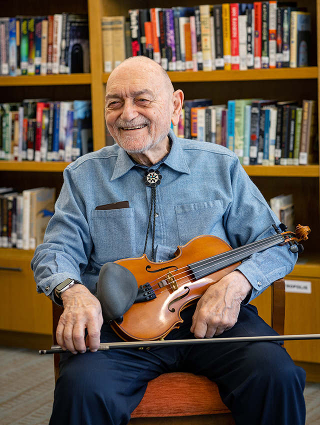 smiling resident with violin