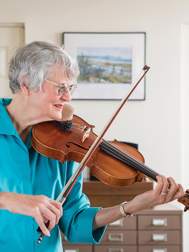Woman resident playing violin