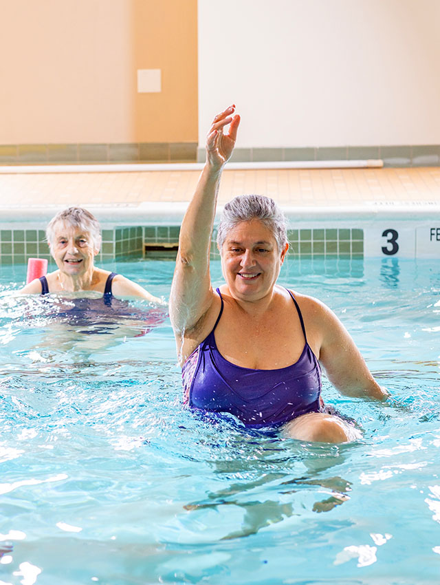 senior woman exercising in a pool