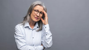 Senior Woman Holding Her Head