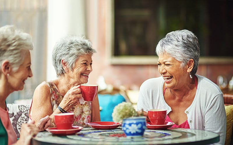 Shot of a group of elderly friends having coffee together