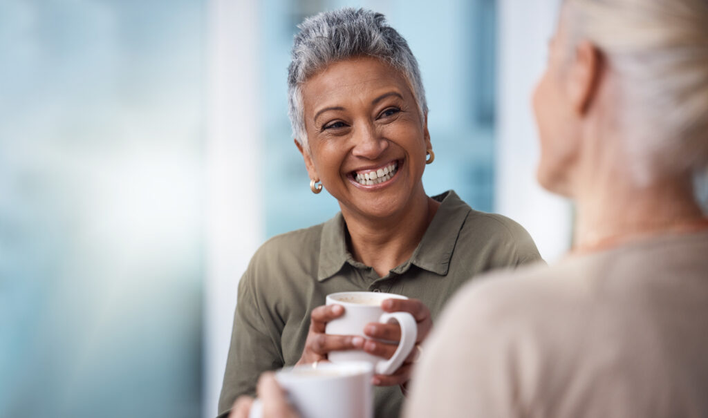 Mockup, senior woman holding a cup of coffee while smiling