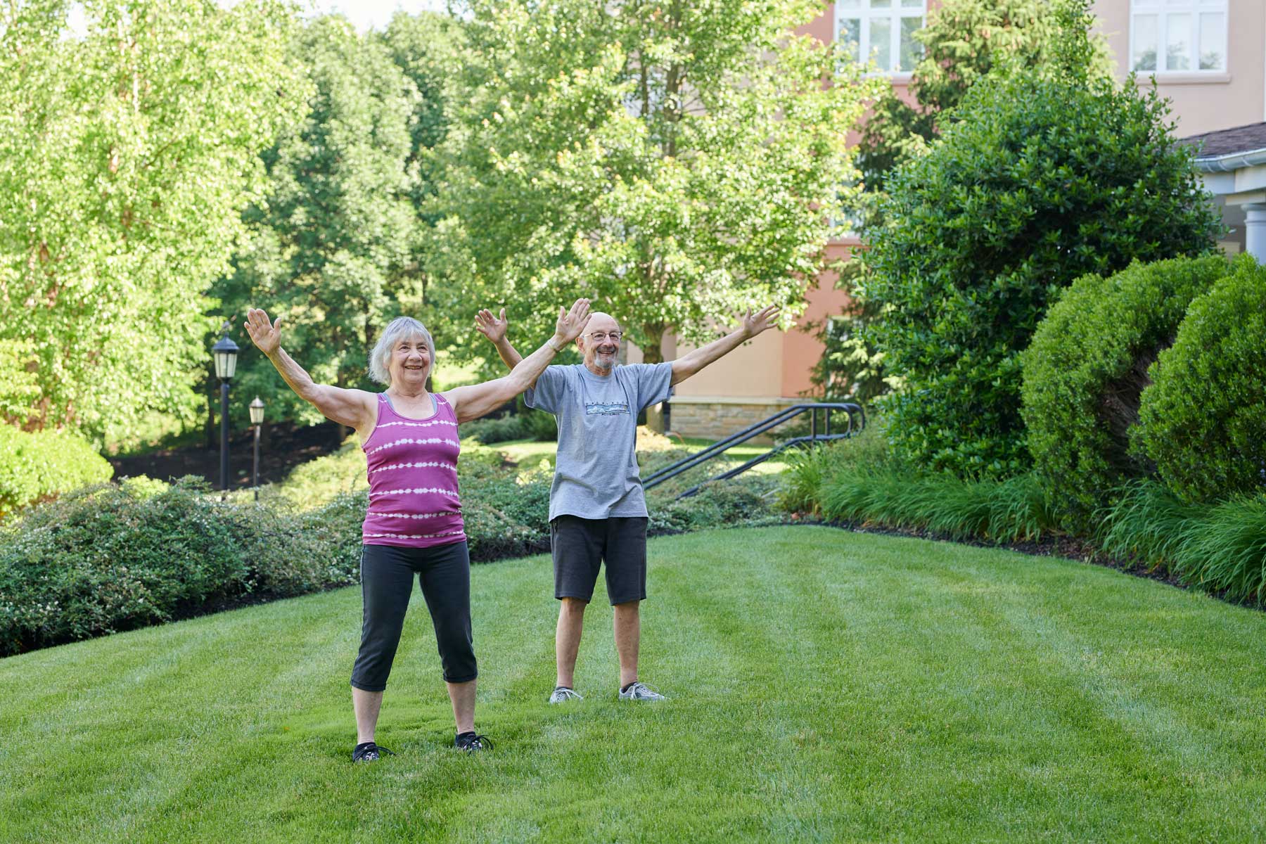 a senior couple doing tai chi outside