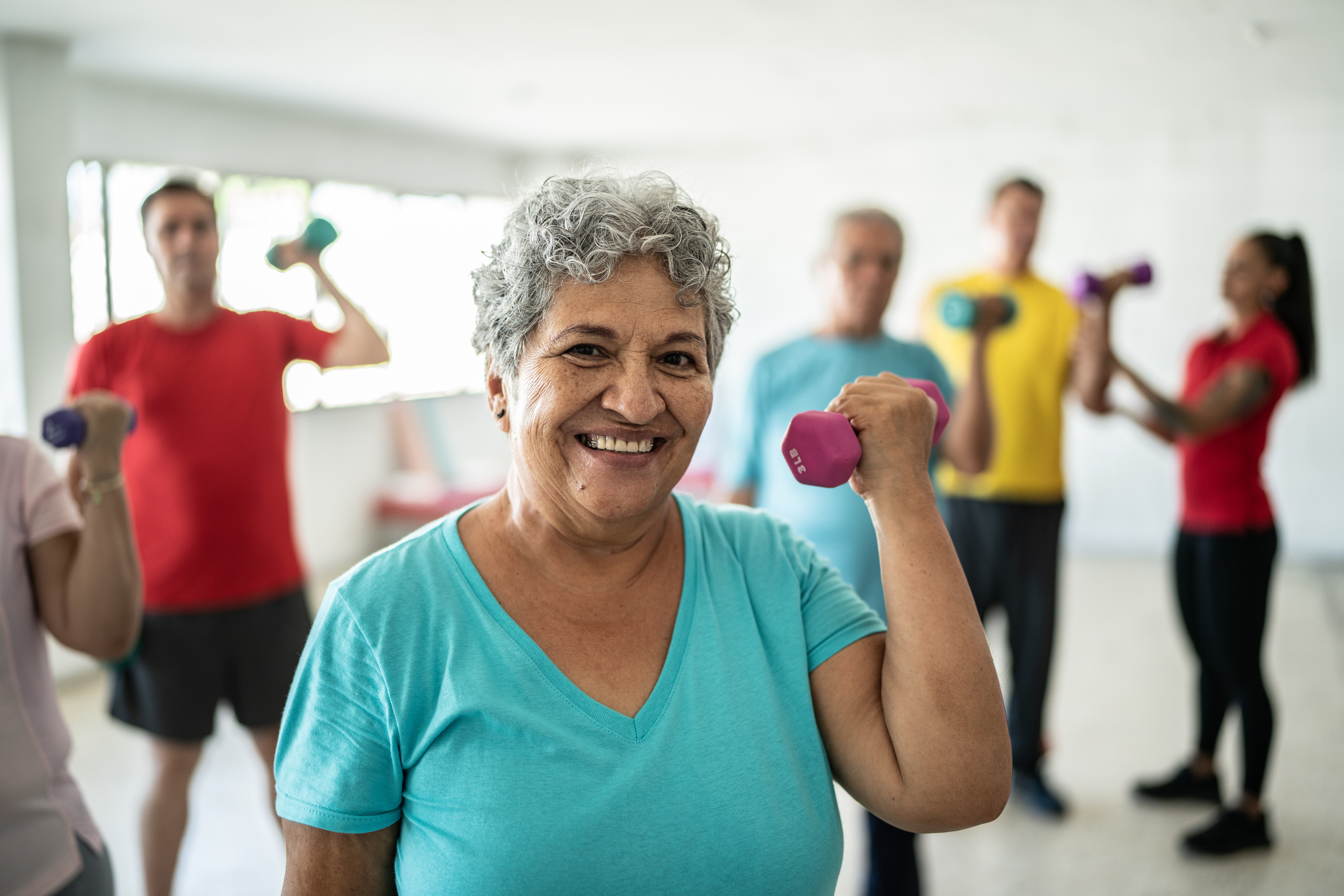 Senior woman lifting weights