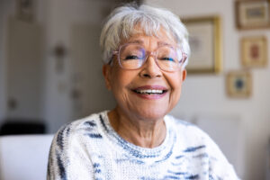 Senior woman considering life plan communities pros and cons