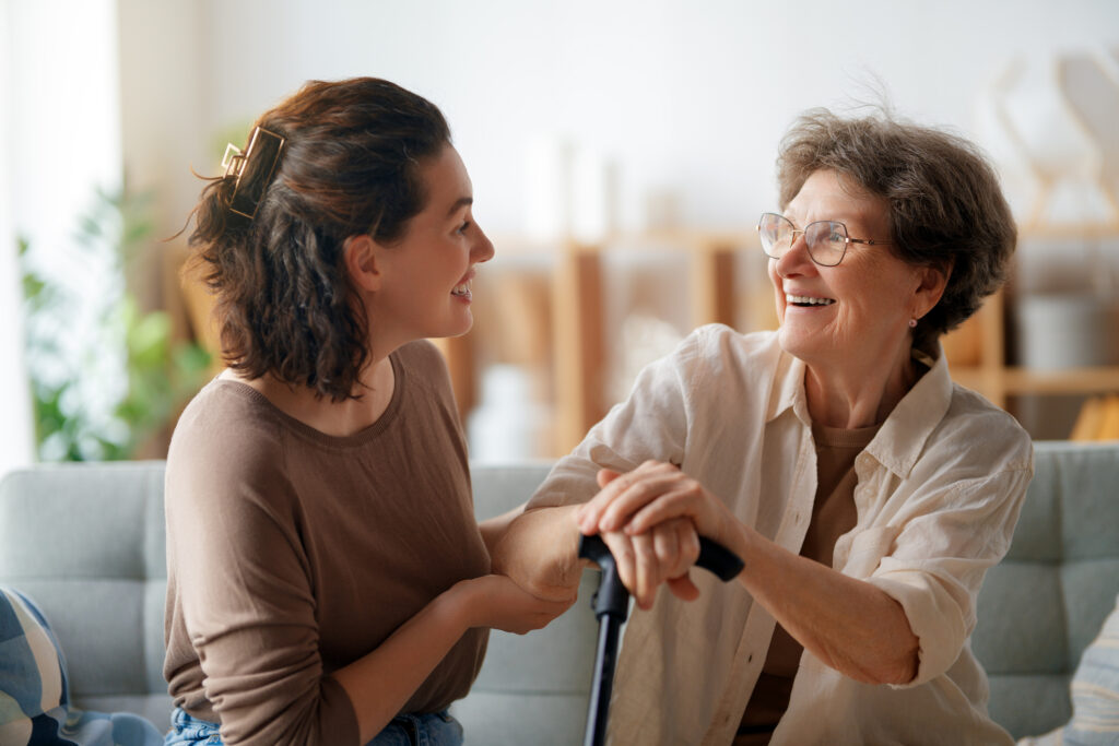 senior woman and young woman smiling 