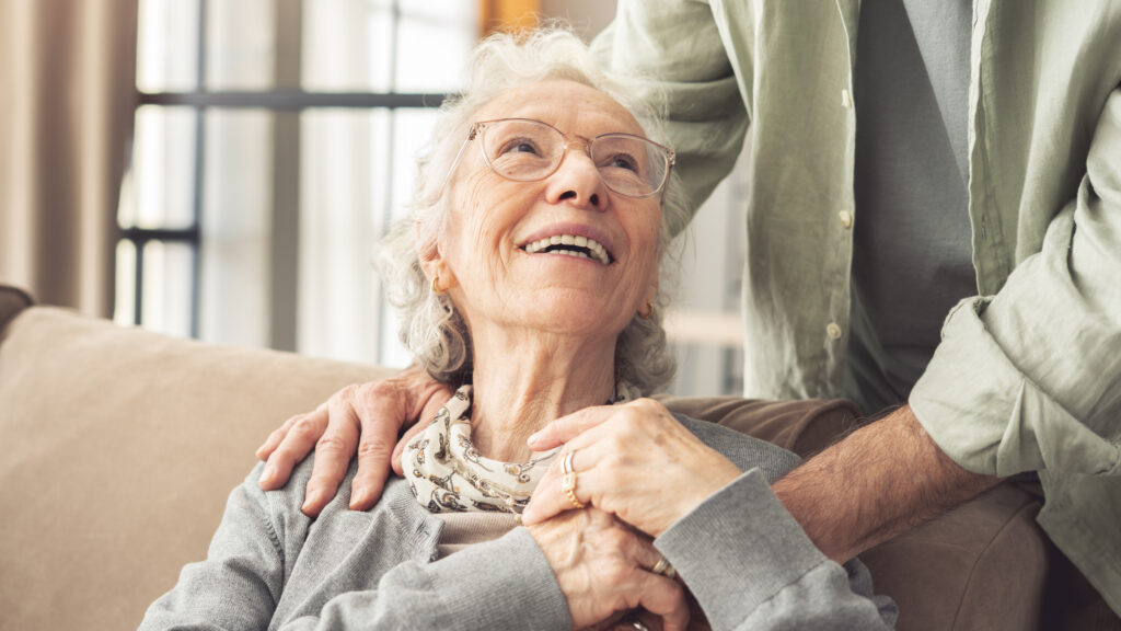 senior woman looking up at loved one